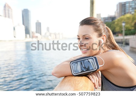 Young woman in New York city relaxing after exercising 