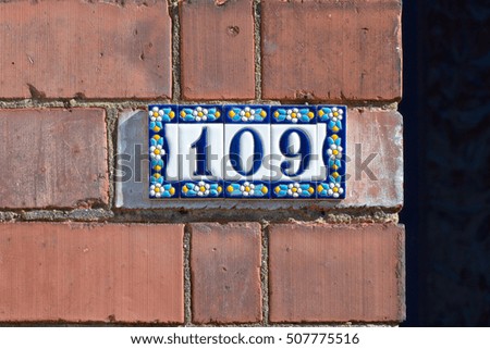 House number 109 sign