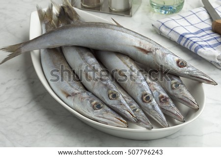 Dish with fresh raw barracuda fishes  Royalty-Free Stock Photo #507796243