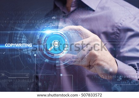Business, Technology, Internet and network concept. Young businessman working on a virtual screen of the future and sees the inscription: copywriting