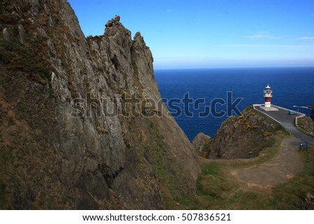 Cape Ortegal Lighthouse,tourist trip on board fishing boat by the Cape Ortegal, the Aguillons and the highest cliffs of Continental Europe, Galicia, Spain. Hatchery of barnacles, Concellos de Cariño  