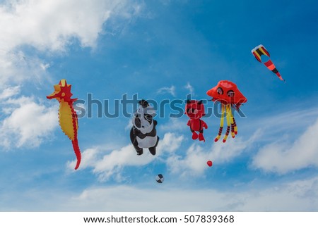 Colorful kites of various shapes.