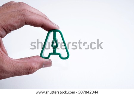 hand hold plastic alphabet A