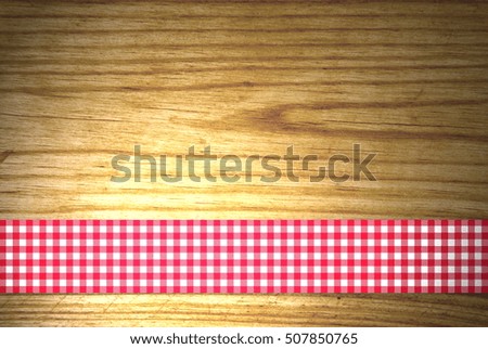 Wooden background with tablecloth stripe