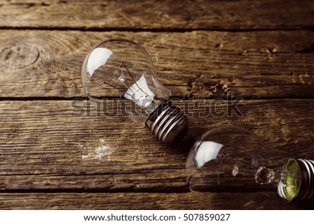 Light bulbs on rustic old table