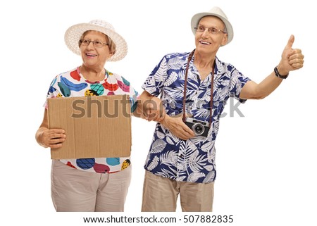 Mature tourists hitchhiking and holding a blank cardboard sign isolated on white background