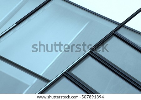 Complexity of modern windows structure. Contemporary glass architecture. Fragment of office building or business cityscape. Abstract industrial photograph.
