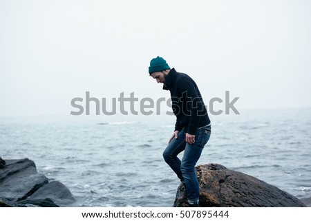atmospheric pictures of sailor at sea, where it goes on the rocks and surrounded by rocks