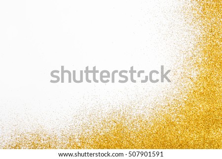 Golden glitter sand texture frame on white, abstract background with copy space. Yellow dusty shimmer decoration border, shiny and sparkling. Holidays and glamour concept.
