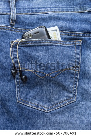 jeans smartphone, money headphones in the back pocket