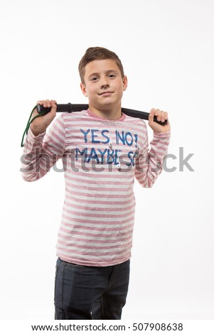 Actor brunette boy in a pink jumper with a baton on a white background