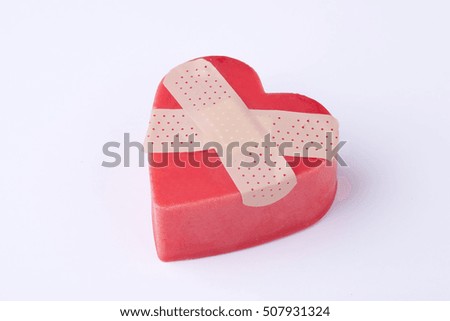 wounded heart with plasters
