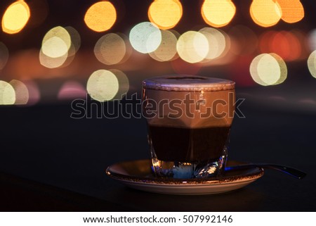 Latte coffee at coffee shop and blur background with bokeh