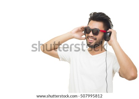 Asian handsome man with a mustache, smiling and laughing listen music with headphones isolated on white background