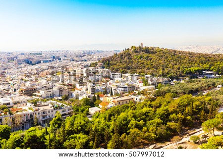 Panorama of Athens, Greece with houses and Filopappos Monument, Filopappos Hill