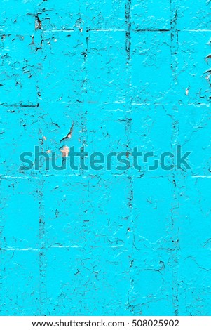 Textured background of brick wall with remains of old paint with cracks, scratches and dust