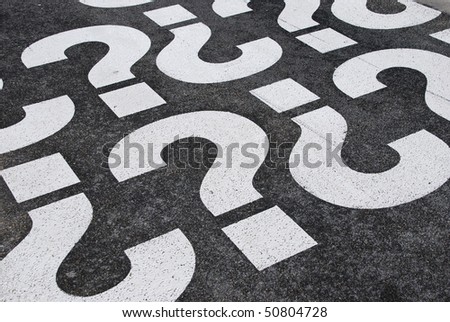 question mark signs painted on a asphalt road surface Royalty-Free Stock Photo #50804728