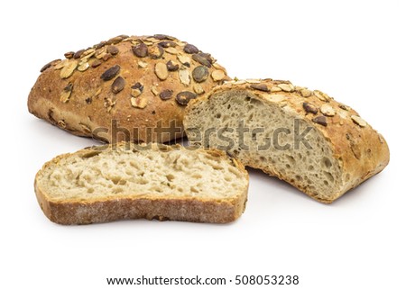Rustic, organic bread with pumpkin seeds isolated on white. Clipping path included in JPEG.