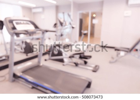 Abstract blur gym and fitness room interior for background.