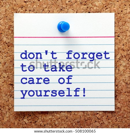 The words Don't Forget to Take Care of Yourself on a note card pinned to a cork notice board as a reminder to look after our own mental and physical health Royalty-Free Stock Photo #508100065