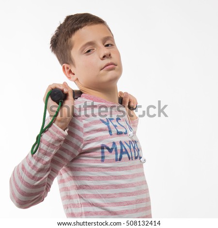 Actor brunette teenager boy in a pink jumper with a baton on a white background