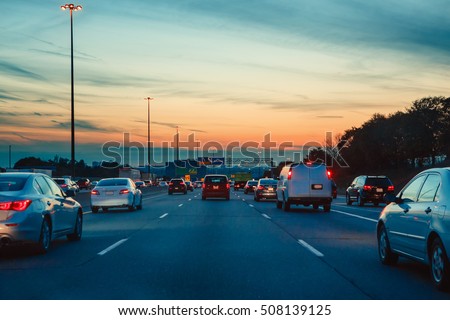Night traffic, cars on highway road on sunset evening night in busy city, urban view, toned with retro vintage hipster filters Royalty-Free Stock Photo #508139125