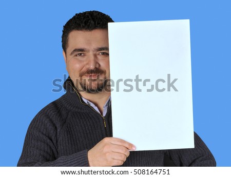 Young man holding blank sign All on blue background