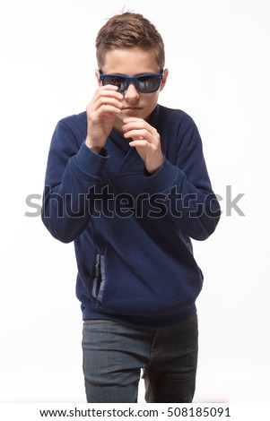 Actor brunette teenager hipster boy in sunglasses on a white background