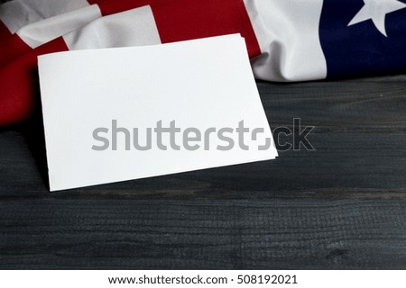 United States of America flag with empty space to write your text on wooden background and paper