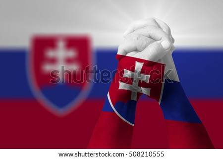 Man clasped hands patterned with the SLOVAKIA flag