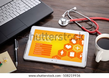 Parkinson's Disease on screen tablet pc, health concept. Information technology and mobile application in healthcare/medical.