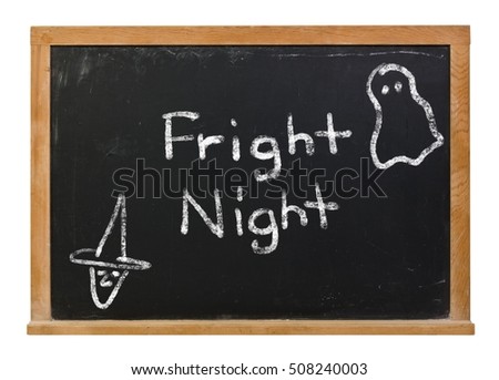 Fright Night written in white chalk on a black chalkboard isolated on white