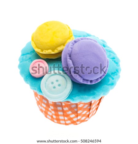 Cupcake and icing candy on top isolate on white background