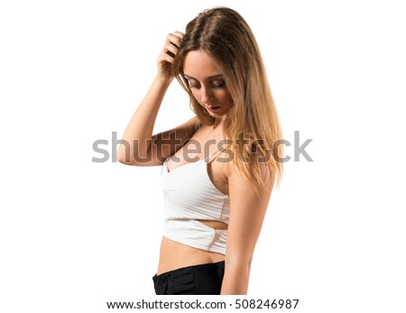 Blonde teen girl posing in studio