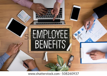 EMPLOYEE BENEFITS Man working on tablet TECHNOLOGY COMMUNICATION Royalty-Free Stock Photo #508260937