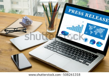 Press Release Laptop on table. Warm tone Royalty-Free Stock Photo #508261318