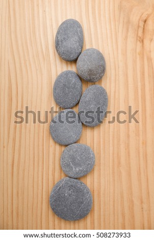 pile of stones on a wooden board