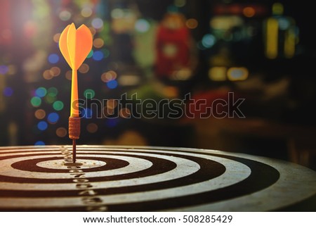 target dart with arrow over blurred Christmas background ,image for target marketing for Christmas Holiday sale concept.