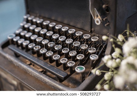 vintage Typewriter with flower on old cabinet deroration in restaurant