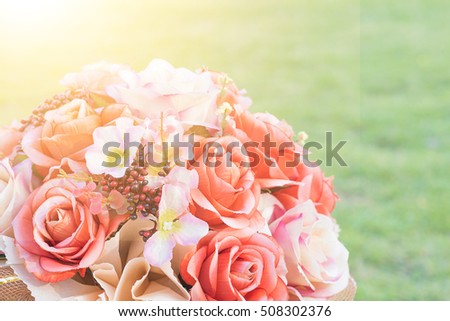 Close up flowers background. Amazing view of many flowers and green grass landscape at sunny summer or spring day. vintage tone.