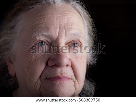 Portrait of elderly woman. Sad. Toned.
