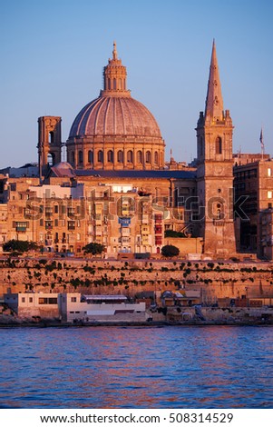 The Basilica of Our Lady of Mount Carmel as seen from Sliema over the Marsamxett Harbour at evening, Valletta, Malta
