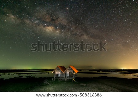 Milky way over the ruin twin house at Thale noi, Phatthalung, Thailand.