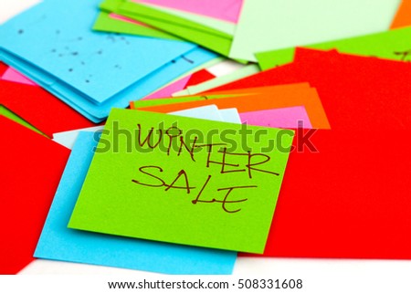  Note papers on white background,winter sale text