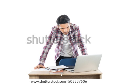 Young businessman working with his laptop isolated on white background.