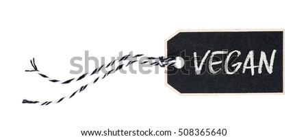 Black tag on a white background with the text Vegan