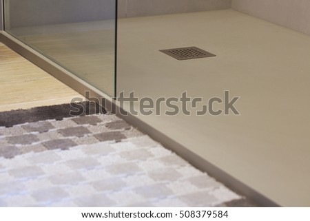Shower drain box grate on a shower base. Royalty-Free Stock Photo #508379584