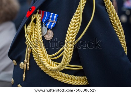 Norwegian naval forces servicemen taking part in the ceremony on Veterans Day Remembrance Day Remembrance poppy. Medals on chest. Unrecognizable person and place