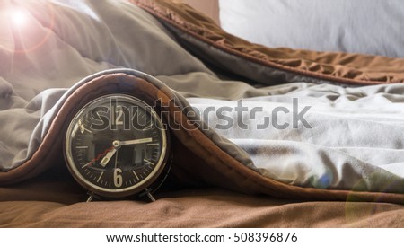Time for Saying Good Morning on the bed, the word of greeting, the alarm clock Royalty-Free Stock Photo #508396876