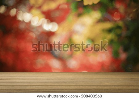 Wooden desk or wooden floor on bokeh light out of focus background.use for present or mock up your product